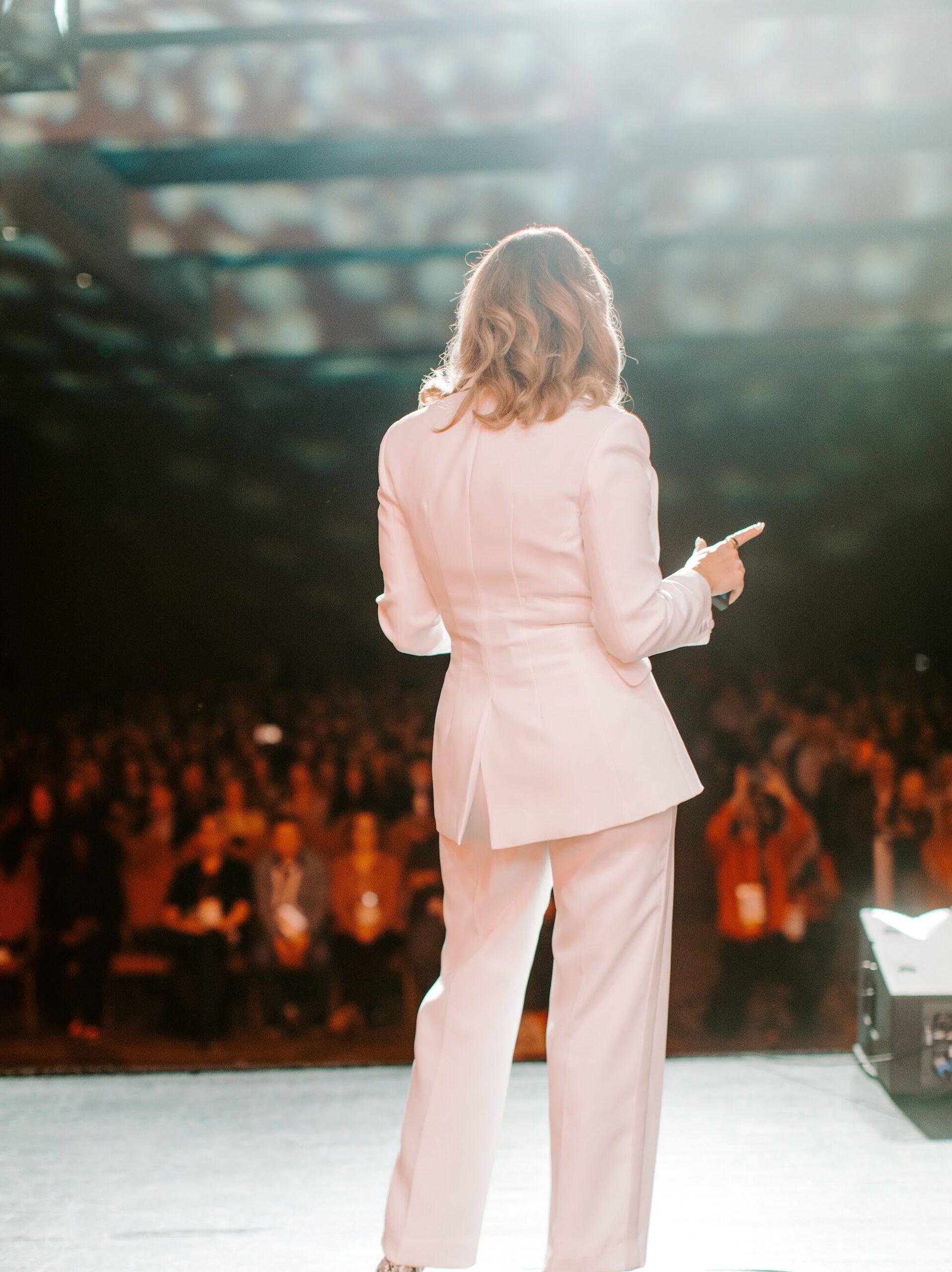 Julie Solomon speaking on stage at Image USA 2023